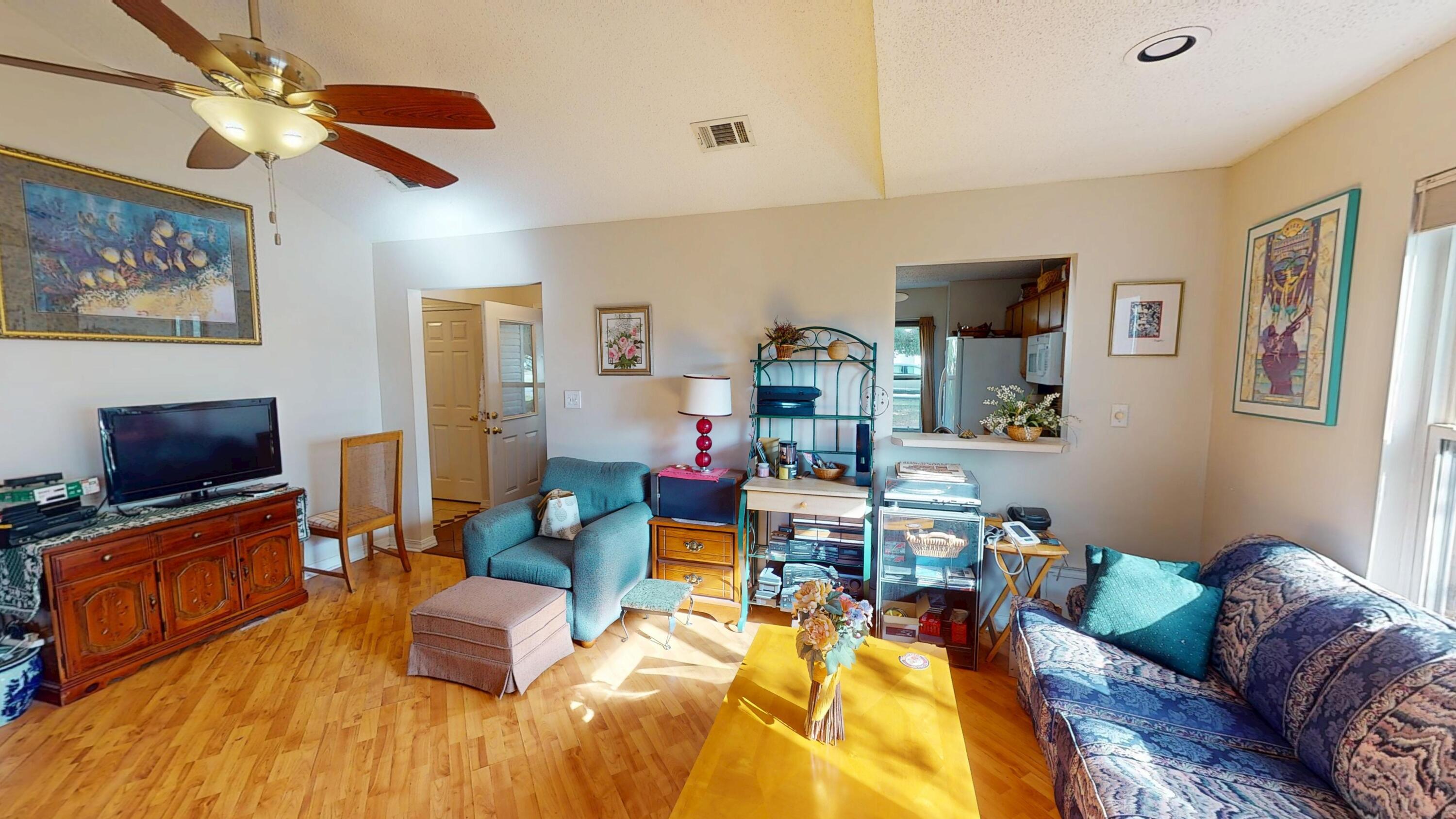 2293 Estate Circle Navarre, FL 32566 - Photo 7 of 41 a living room with furniture and a flat screen tv