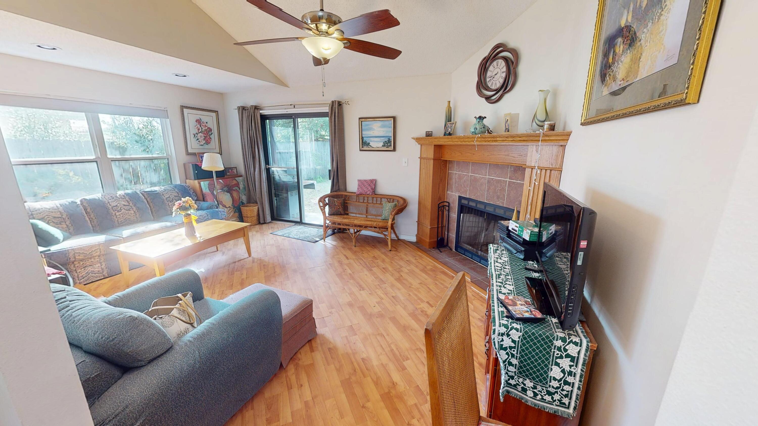 2293 Estate Circle Navarre, FL 32566 - Photo 9 of 41 a living room with furniture and a fireplace