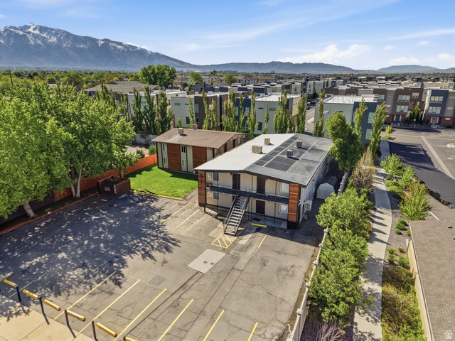 831 Lennox Street, Unit 5 Midvale, UT 84047 - Photo 17 of 19 Aerial view of residential area featuring a mountainous background