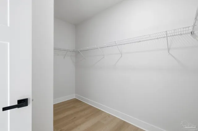 a view of a room with racks on the wall