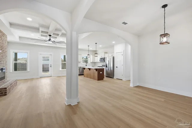 a view of a living room and kitchen