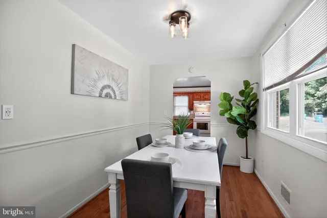 a view of a workspace with furniture and a potted plant