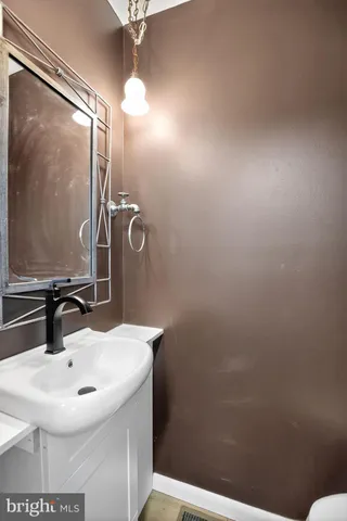 a bathroom with a sink and mirror