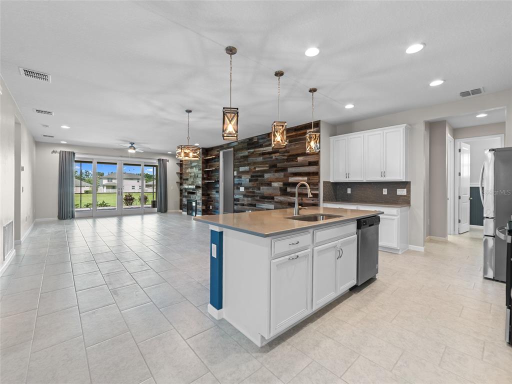1010 Better Days Place Valrico, FL 33594 - Photo 15 of 55 a kitchen with stainless steel appliances granite countertop a refrigerator and a stove top oven