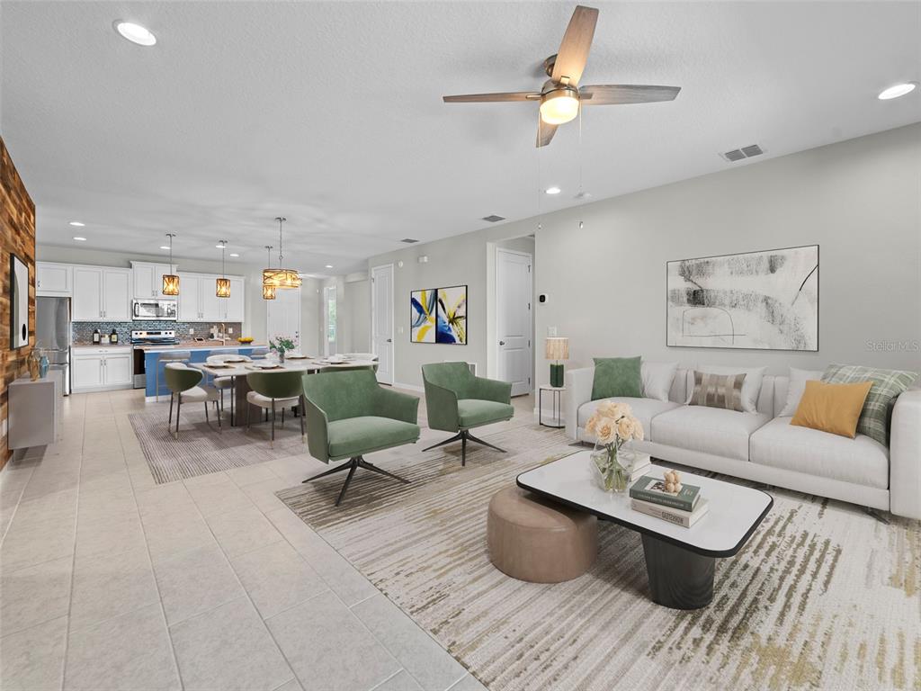 1010 Better Days Place Valrico, FL 33594 - Photo 25 of 55 a living room with furniture and a chandelier