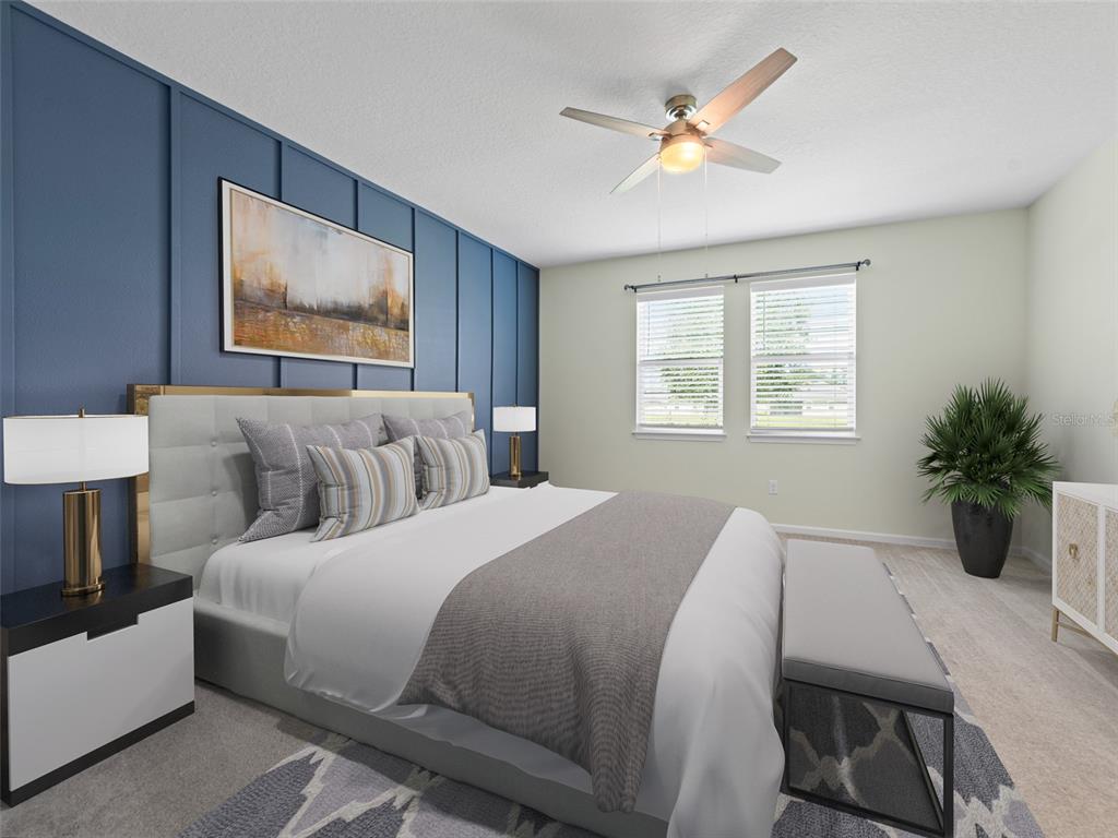 1010 Better Days Place Valrico, FL 33594 - Photo 28 of 55 a bedroom with a large bed and a chandelier