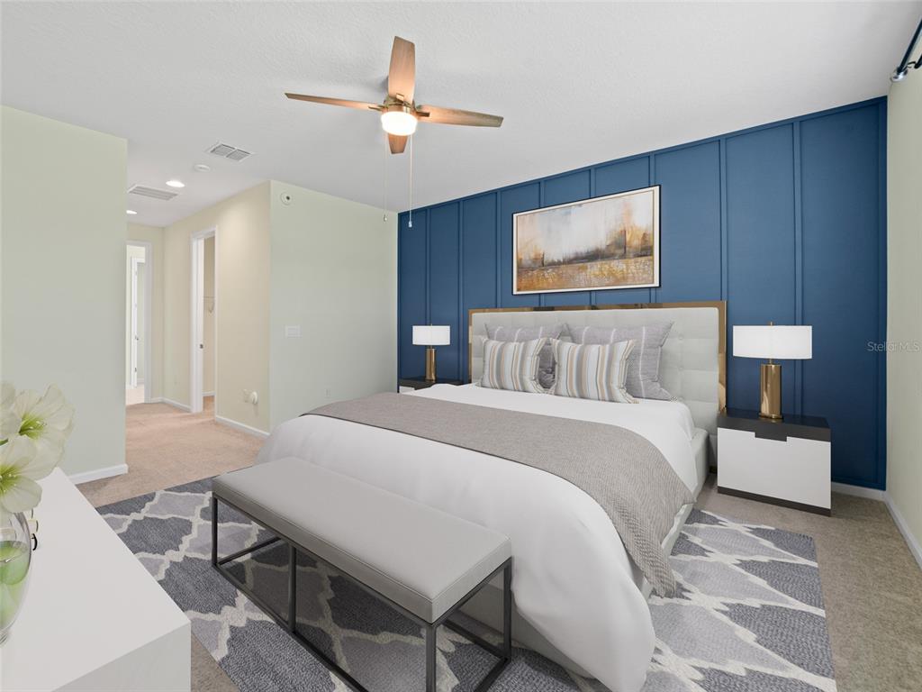 1010 Better Days Place Valrico, FL 33594 - Photo 30 of 55 a bedroom with a bed and a chandelier