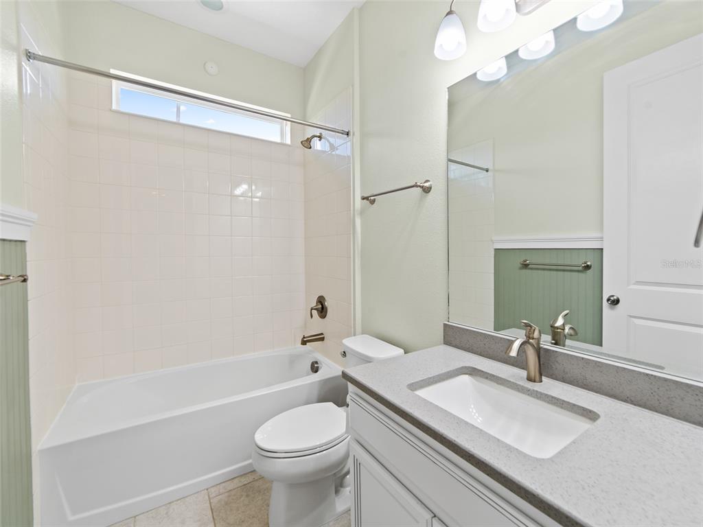 1010 Better Days Place Valrico, FL 33594 - Photo 32 of 55 a bathroom with a sink a toilet a mirror and shower