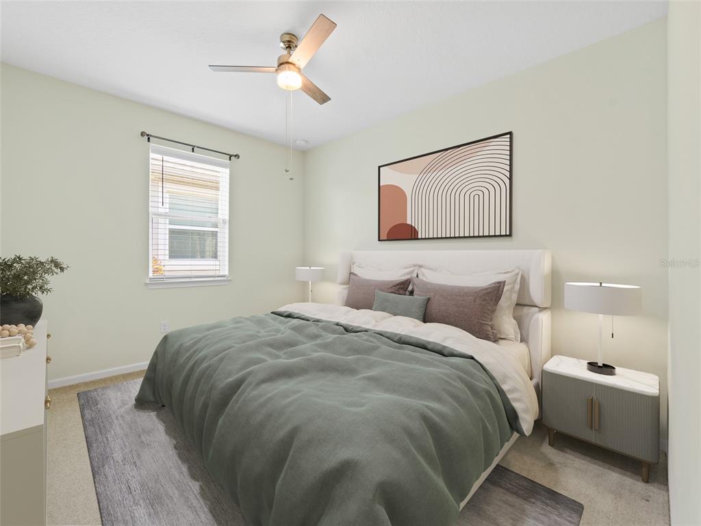 1010 Better Days Place Valrico, FL 33594 - Photo 35 of 55 a bedroom with a bed and a painting on the wall