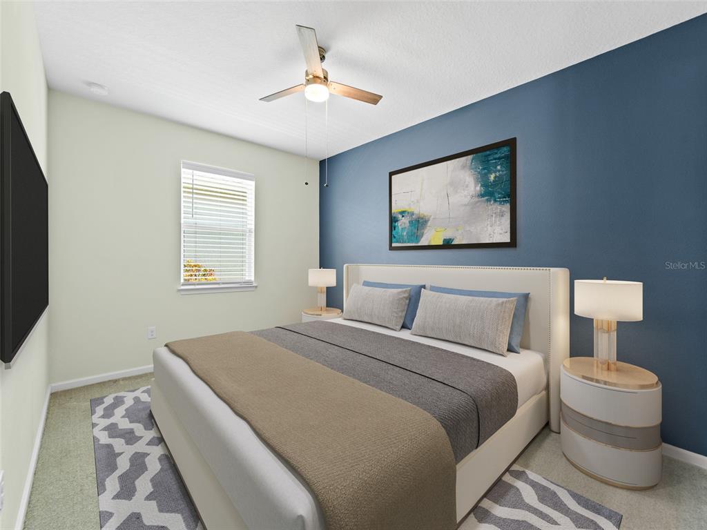 1010 Better Days Place Valrico, FL 33594 - Photo 37 of 55 a bedroom with a bed and a painting on the wall