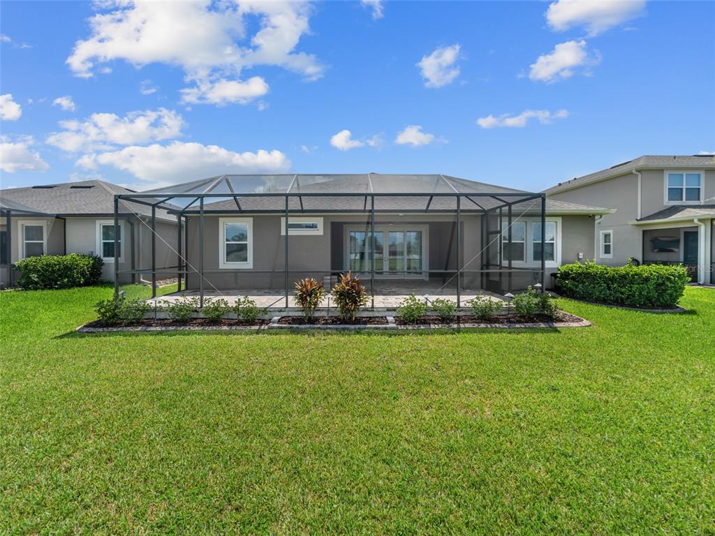 1010 Better Days Place Valrico, FL 33594 - Photo 46 of 55 a front view of house with yard and outdoor seating