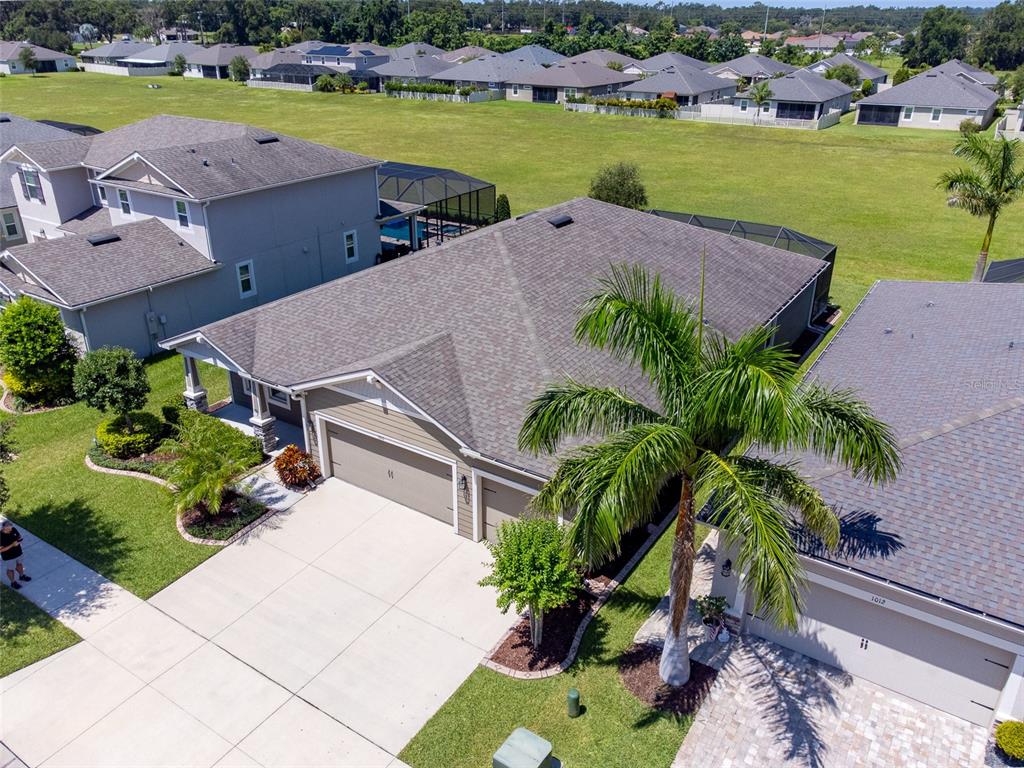 1010 Better Days Place Valrico, FL 33594 - Photo 53 of 55 an aerial view of a house with garden space and lake view