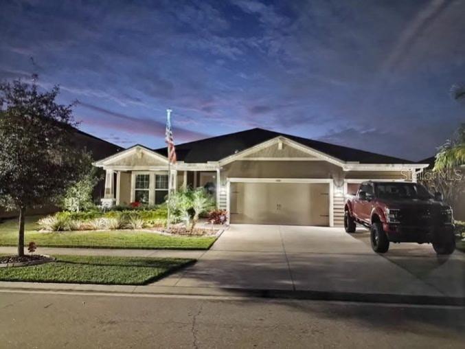 1010 Better Days Place Valrico, FL 33594 - Photo 54 of 55 a front view of a house with a yard