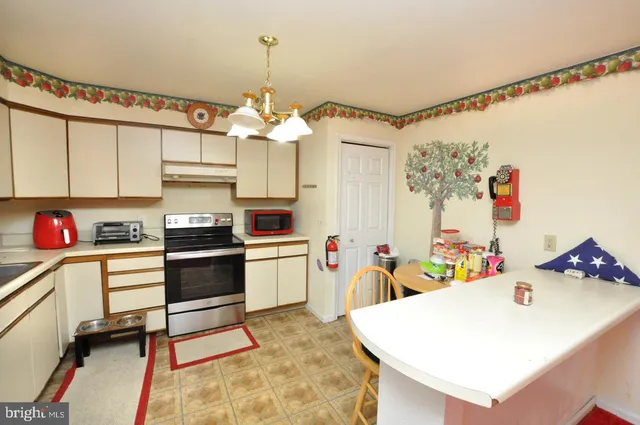 a very nice looking dining room with a table and chairs in it
