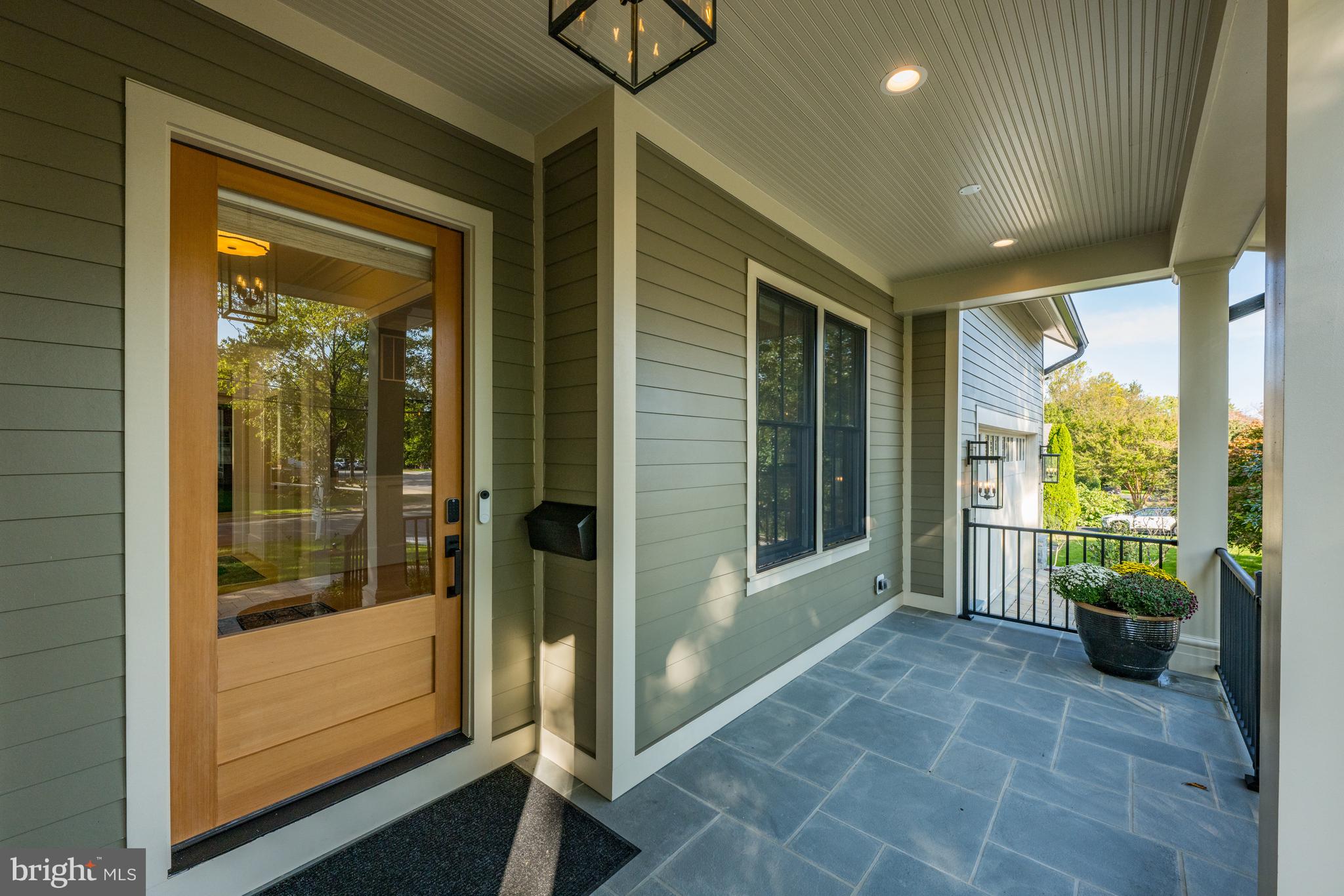 3612 North Rockingham Street Arlington, VA 22213 - Photo 11 of 64 Now Enter Stone Front Porch with Aluminum Railings