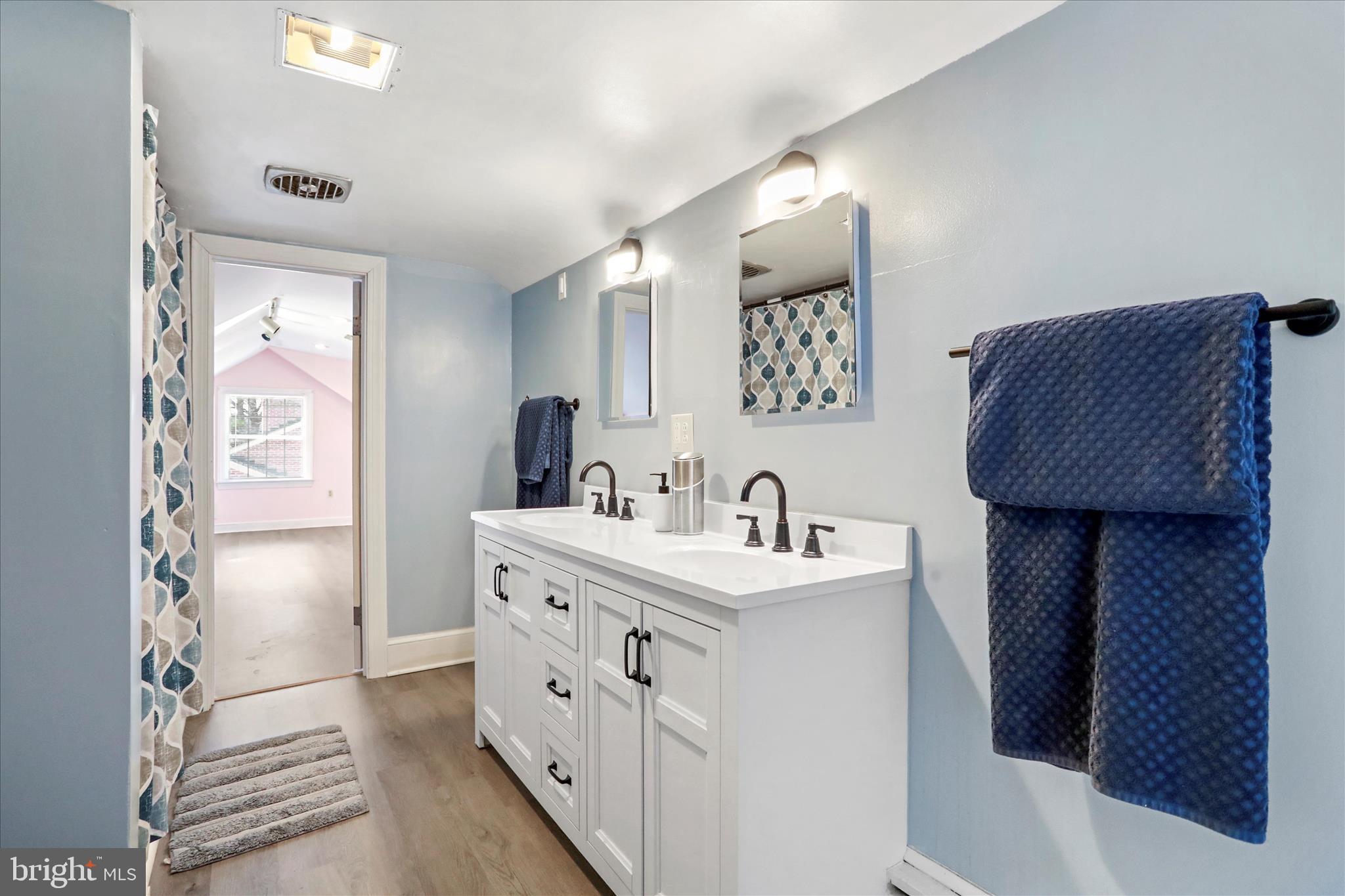 425 West 15th Street Front Royal, VA 22630 - Photo 35 of 47 a spacious bathroom with a sink and a mirror