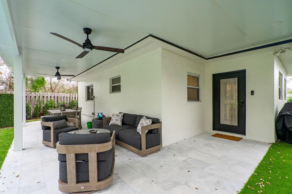 463 Newcastle Street Boca Raton, FL 33487 - Photo 25 of 32 a living room with furniture and a ceiling fan