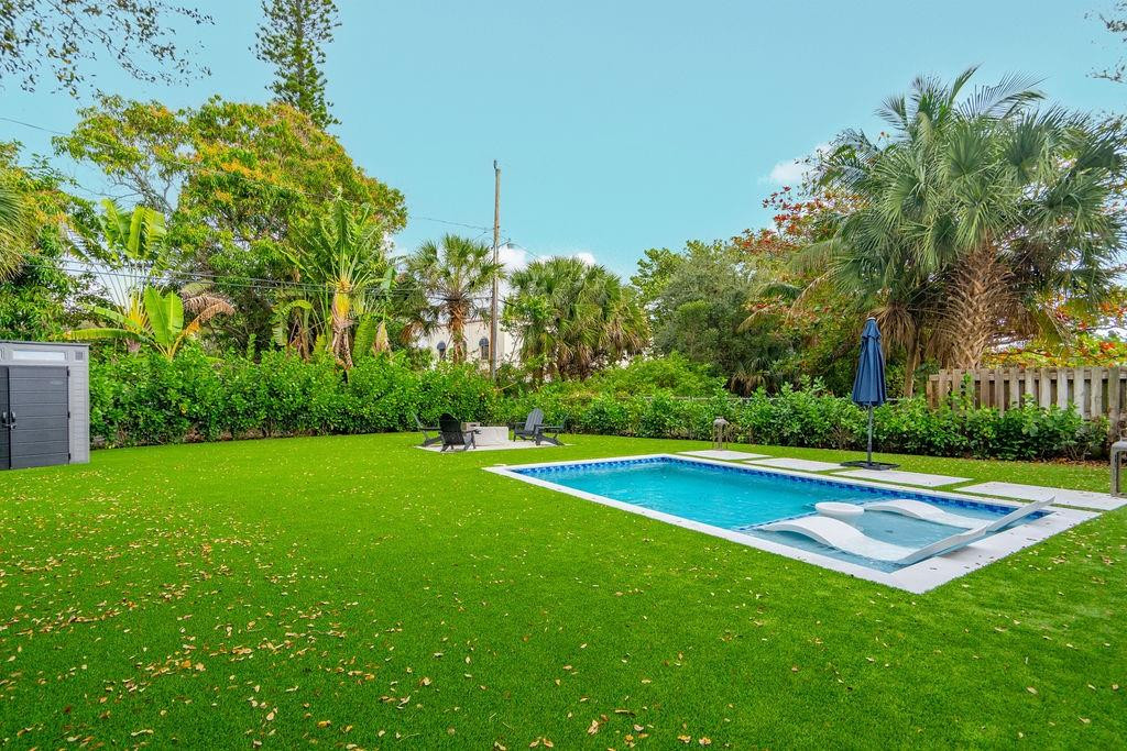 463 Newcastle Street Boca Raton, FL 33487 - Photo 29 of 32 a view of pool with lawn chairs and plants