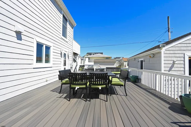 a view of balcony with furniture and wooden deck