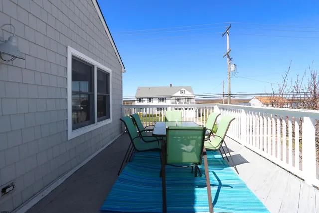 a front view of a house with stairs