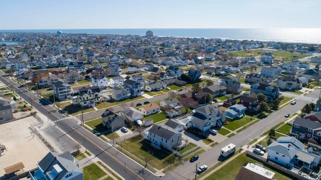 an aerial view of a city with ocean view