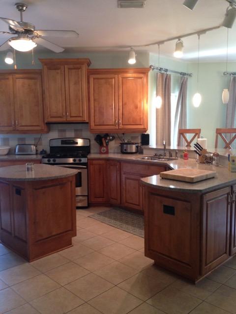 4556 Redbud Trail Niceville, FL 32578 - Photo 12 of 41 a kitchen with stainless steel appliances granite countertop a sink stove and cabinets