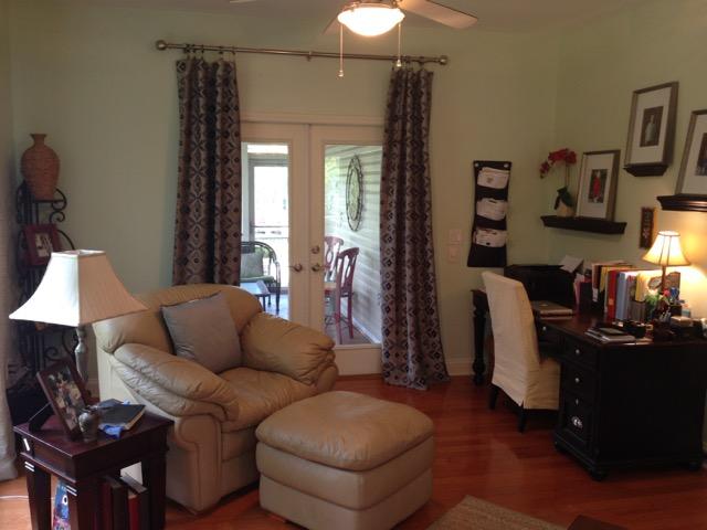 4556 Redbud Trail Niceville, FL 32578 - Photo 16 of 41 a living room with furniture a lamp and a window