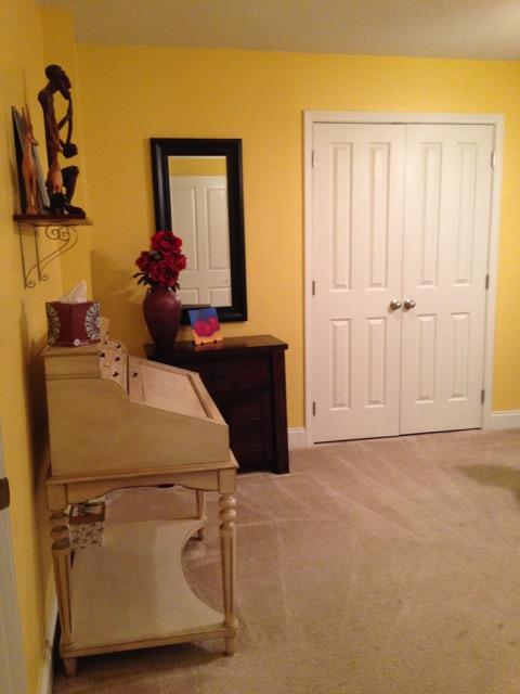 4556 Redbud Trail Niceville, FL 32578 - Photo 21 of 41 a room with a bed and mirror on the dresser