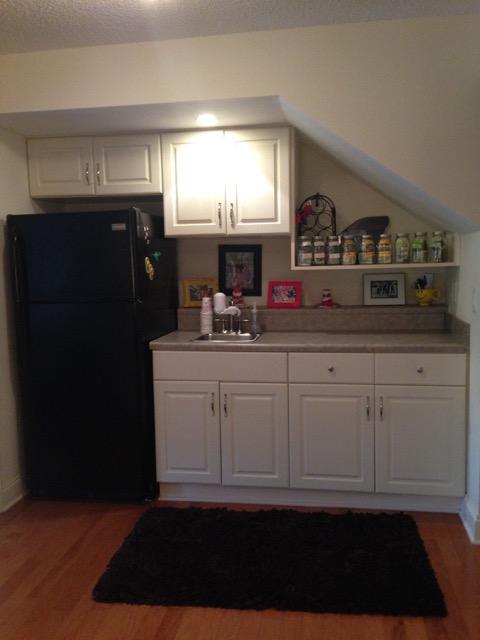 4556 Redbud Trail Niceville, FL 32578 - Photo 25 of 41 a kitchen with a sink and a refrigerator