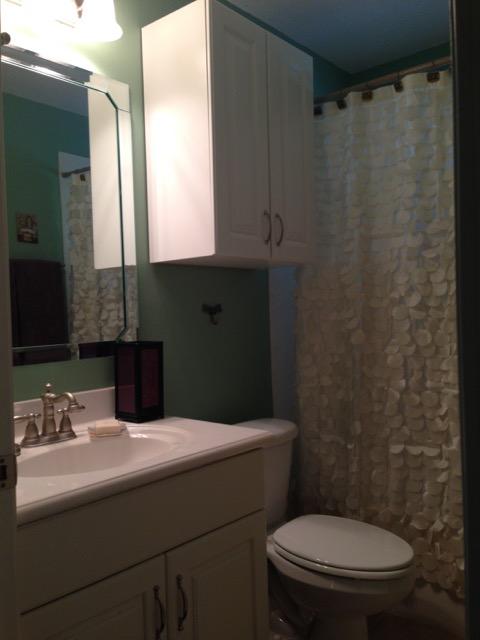 4556 Redbud Trail Niceville, FL 32578 - Photo 27 of 41 a bathroom with a sink a toilet and mirror