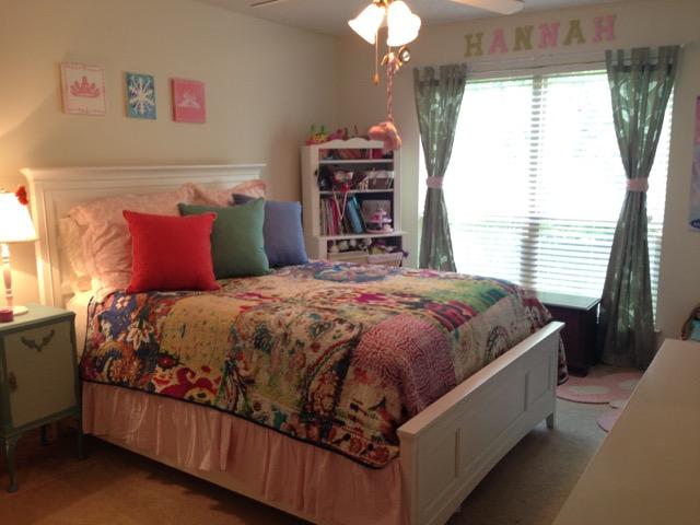 4556 Redbud Trail Niceville, FL 32578 - Photo 29 of 41 a bed sitting in a bedroom next to a window