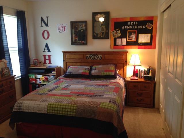 4556 Redbud Trail Niceville, FL 32578 - Photo 33 of 41 a bedroom with a bed and a lamp on dresser