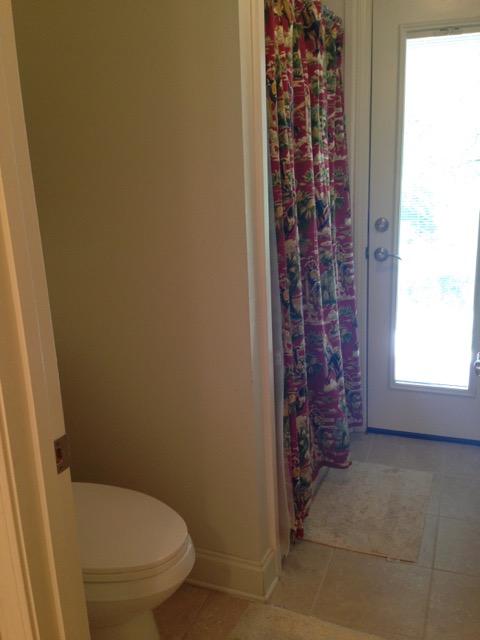 4556 Redbud Trail Niceville, FL 32578 - Photo 34 of 41 a bathroom with a granite countertop toilet and a shower