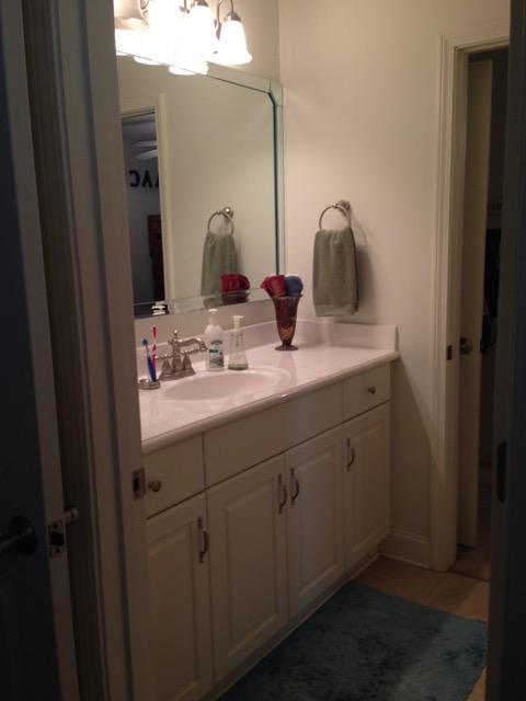 4556 Redbud Trail Niceville, FL 32578 - Photo 35 of 41 a bathroom with a sink vanity and mirror