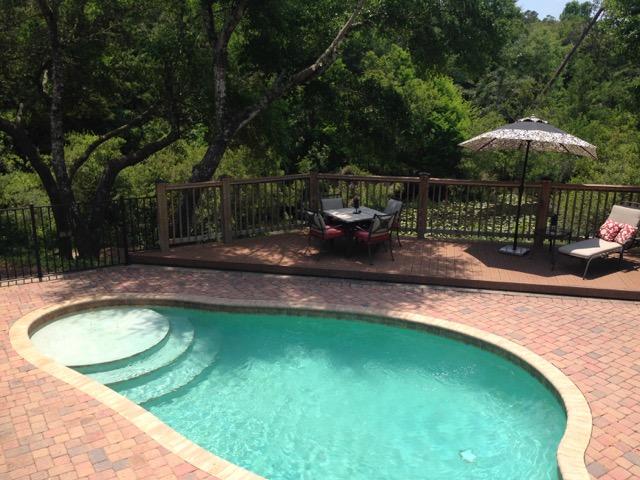 4556 Redbud Trail Niceville, FL 32578 - Photo 36 of 41 a view of a backyard with a swimming pool