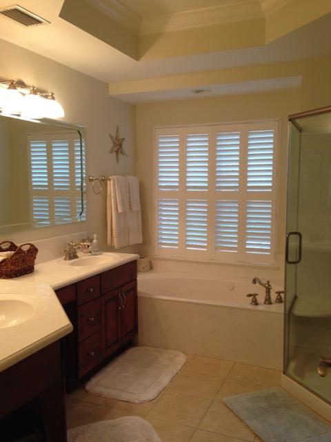 4556 Redbud Trail Niceville, FL 32578 - Photo 7 of 41 a bathroom with a tub sink and mirror