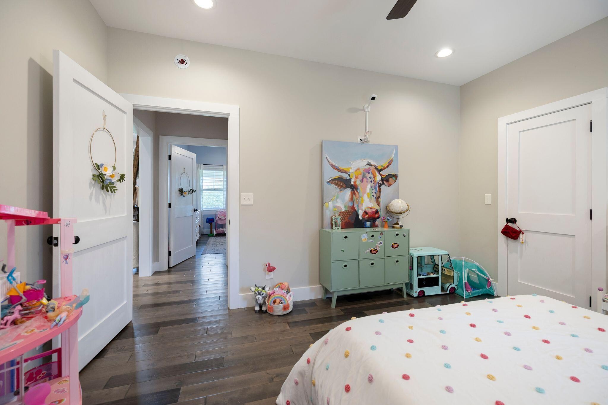 6866 Daus Mountain Road Whitwell, TN 37397 - Photo 18 of 49 a bedroom with a bed and wooden floor