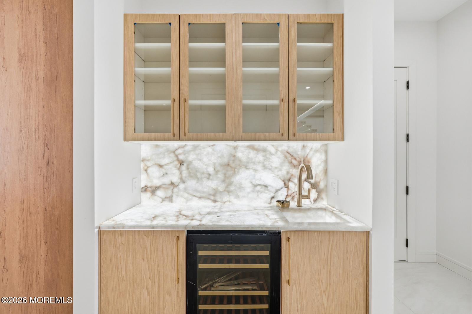 44 Whalepond Road Oakhurst, NJ 07755 - Photo 14 of 16 a bathroom with a granite countertop sink and a window