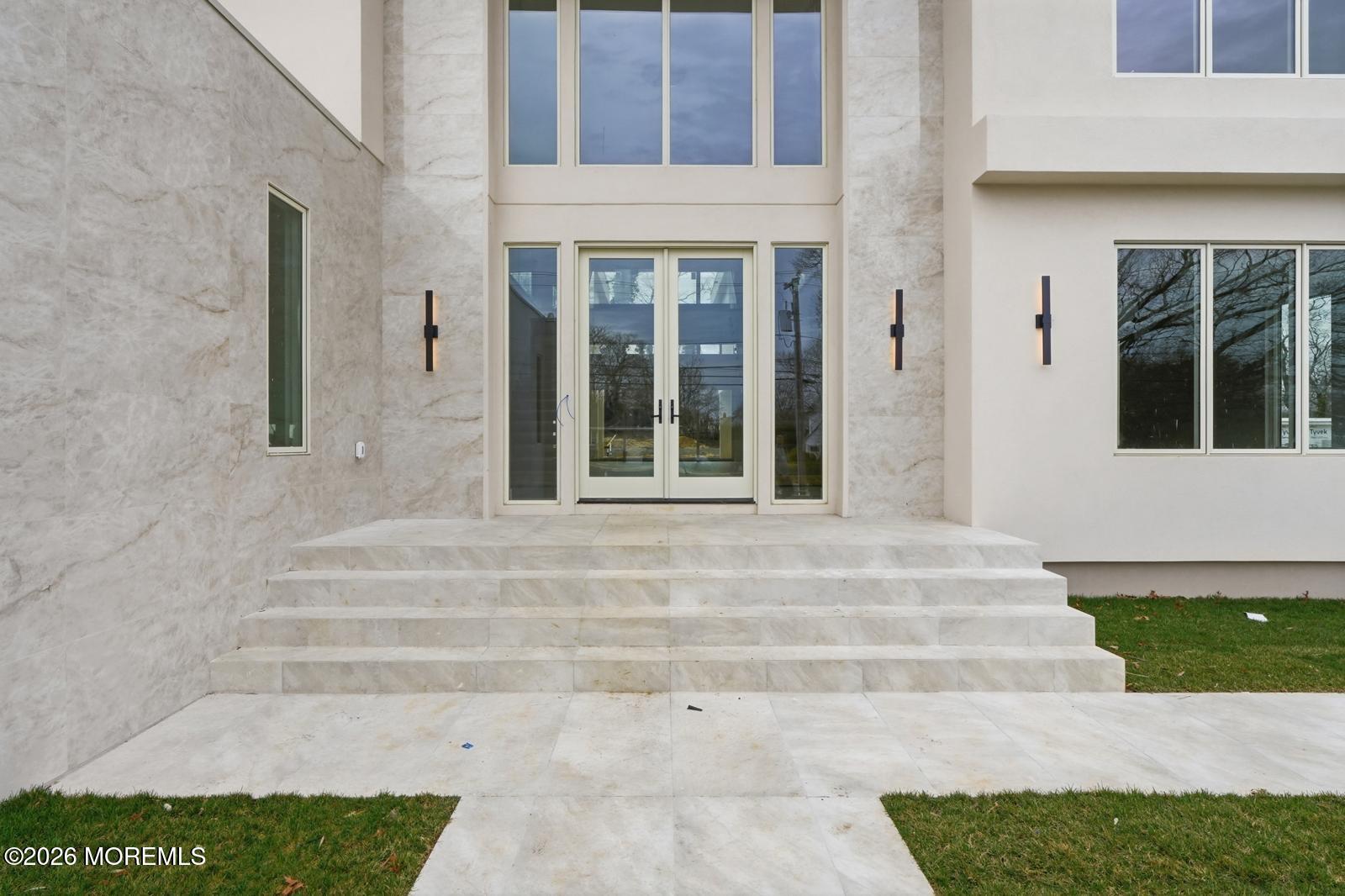 44 Whalepond Road Oakhurst, NJ 07755 - Photo 6 of 16 a front view of a house with entryway