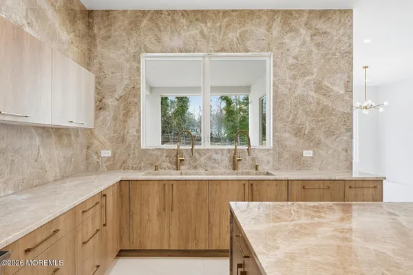 a kitchen with a sink and cabinets