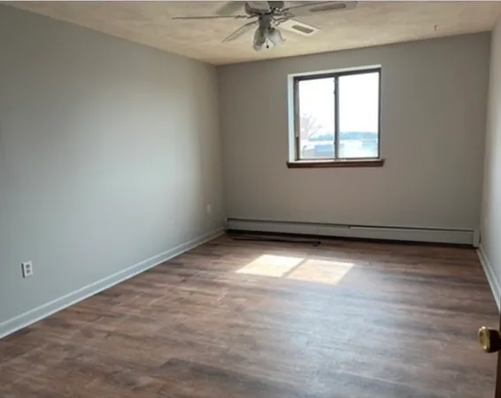 an empty room with a empty space and a window