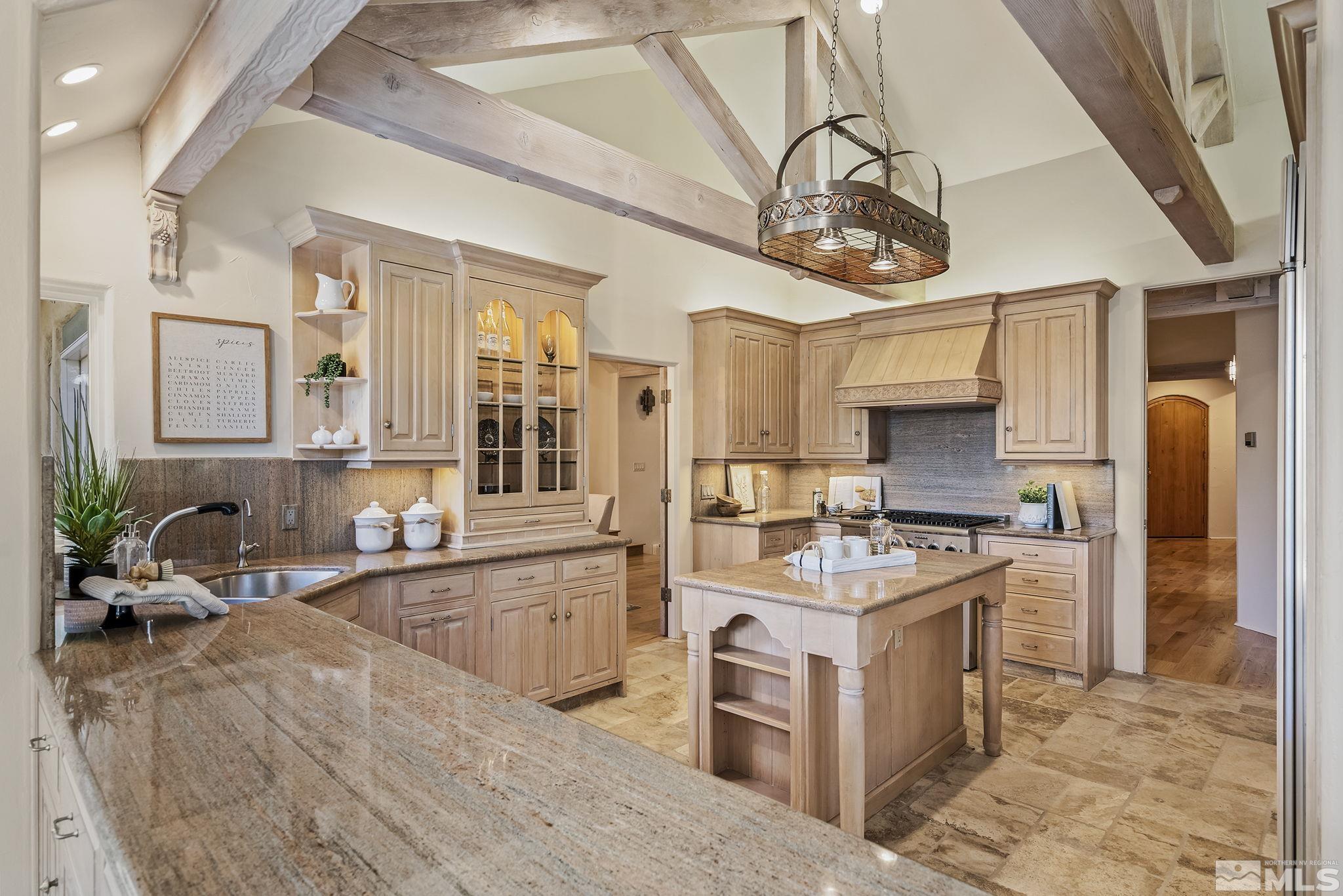 15 Promontory Pointe Reno, NV 89519 - Photo 11 of 40 a kitchen with stainless steel appliances granite countertop a sink stove and refrigerator