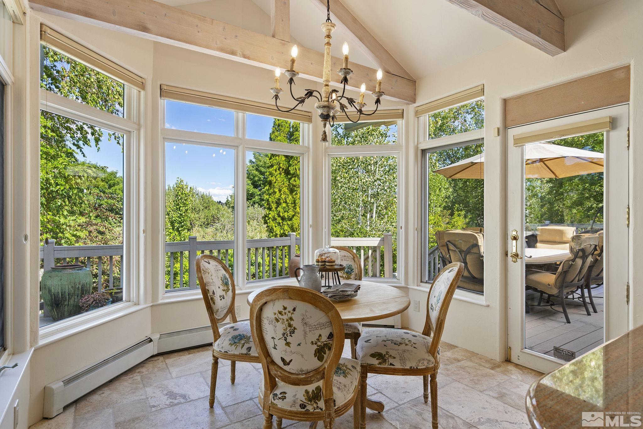 15 Promontory Pointe Reno, NV 89519 - Photo 15 of 40 a view of a dining room with furniture wooden floor and chandelier