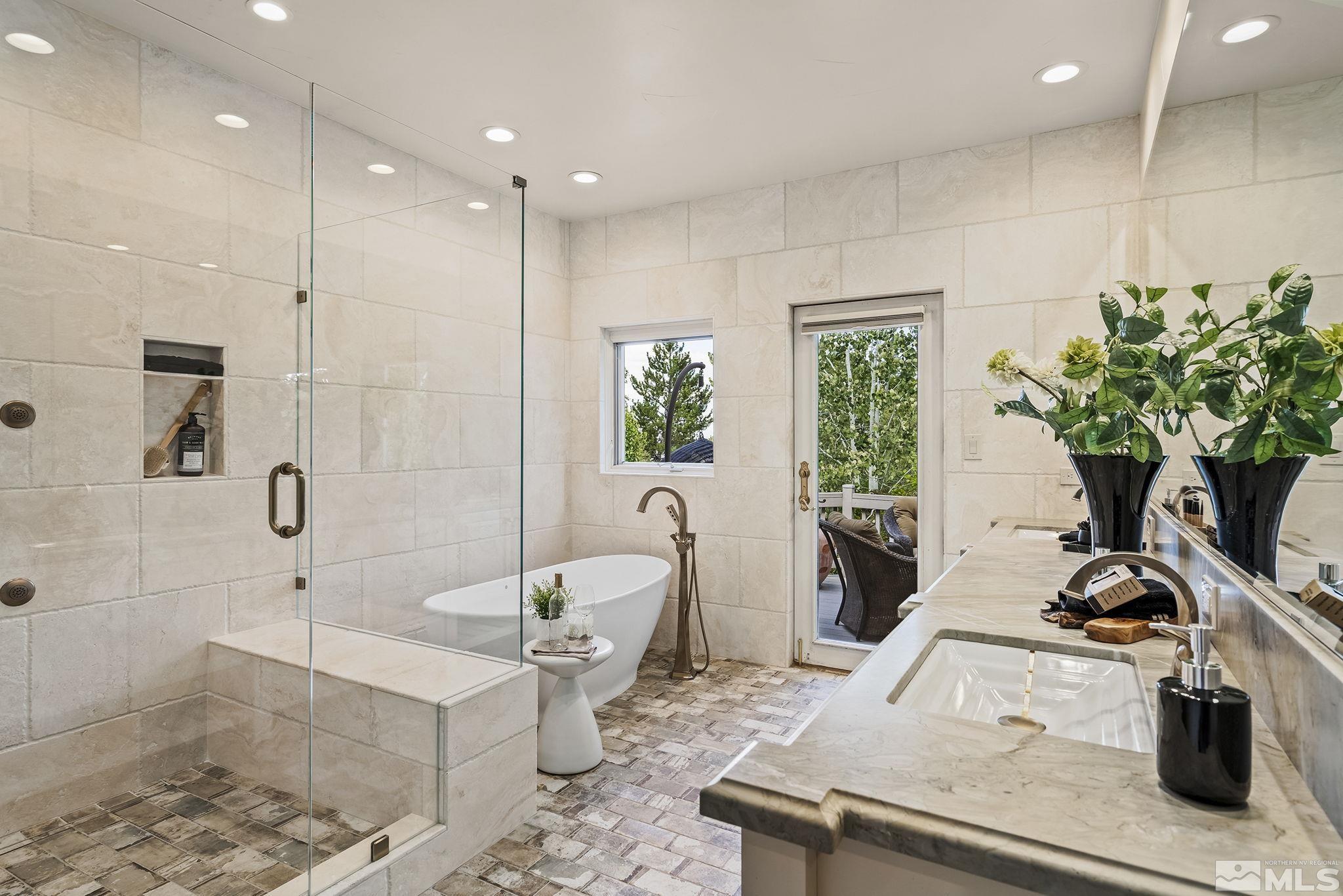 15 Promontory Pointe Reno, NV 89519 - Photo 18 of 40 a living room with furniture a potted plant and a wooden floor