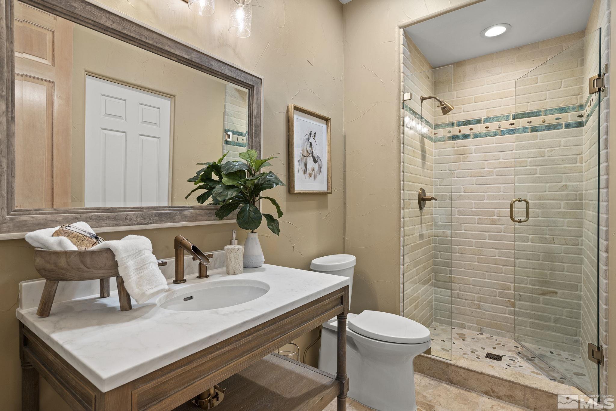 15 Promontory Pointe Reno, NV 89519 - Photo 28 of 40 a bathroom with a sink toilet and shower