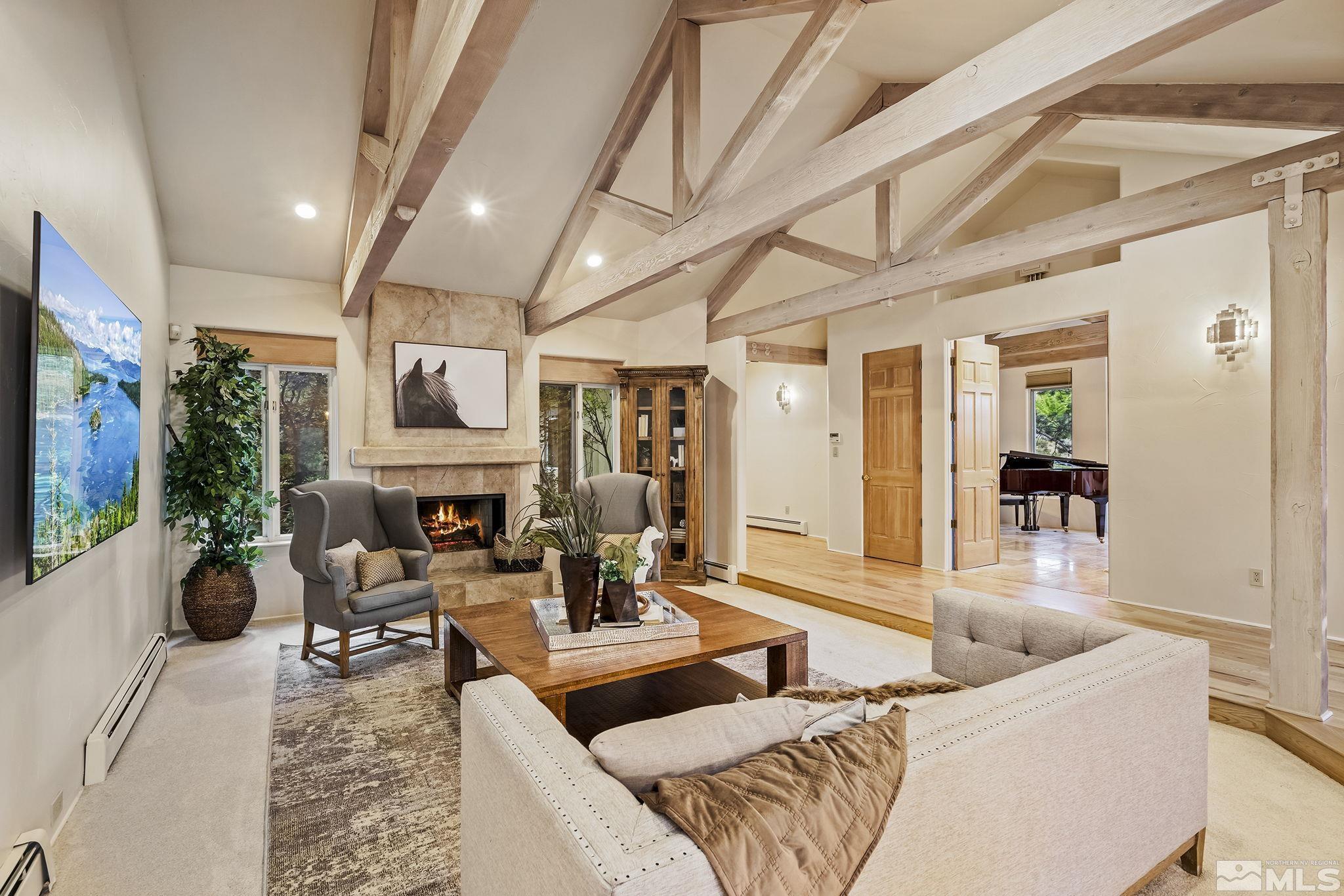 15 Promontory Pointe Reno, NV 89519 - Photo 6 of 40 a living room with fireplace furniture and a flat screen tv