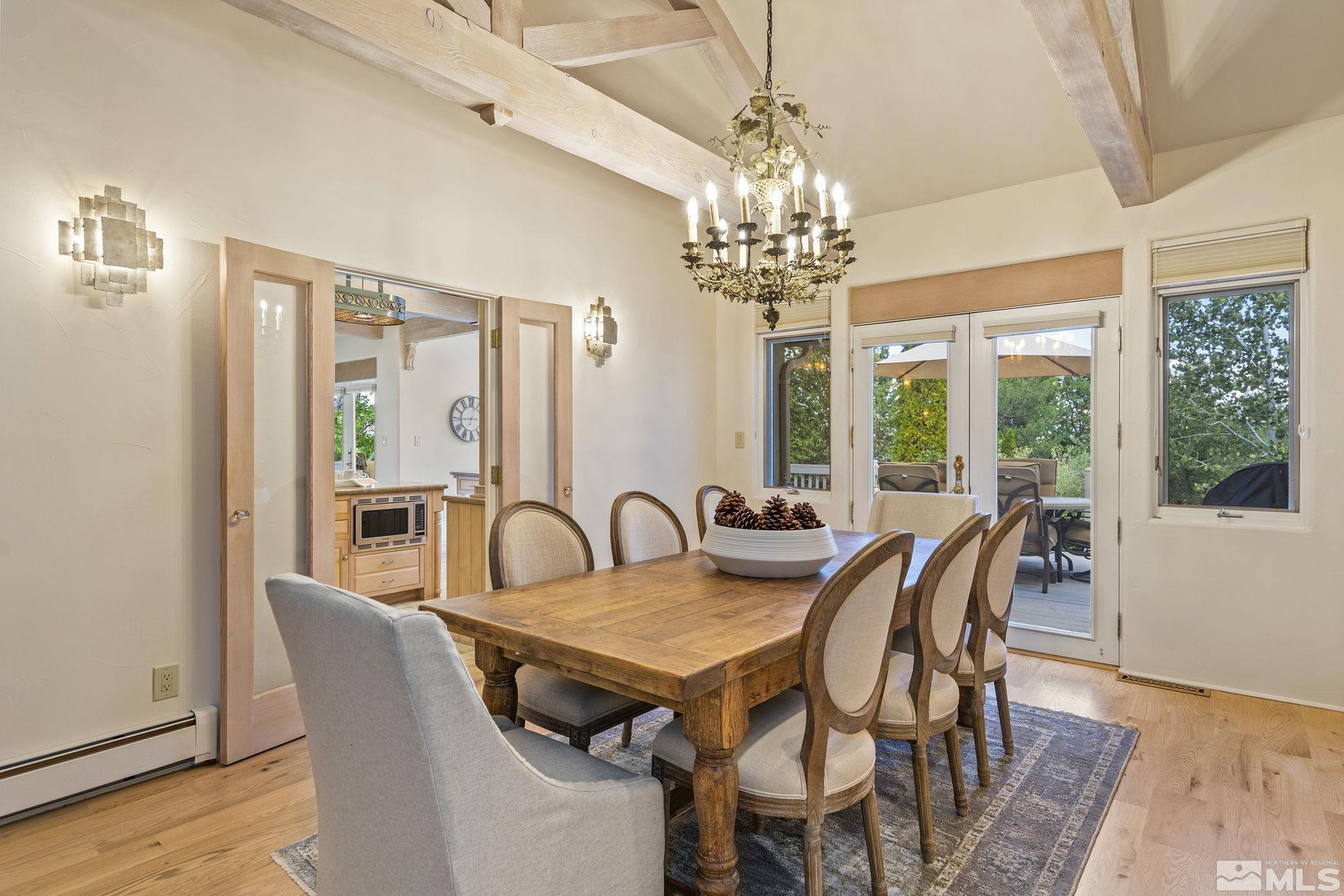 15 Promontory Pointe Reno, NV 89519 - Photo 8 of 40 a view of a dining room with furniture window and wooden floor