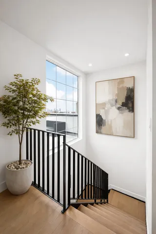 a bedroom with two beds and a window