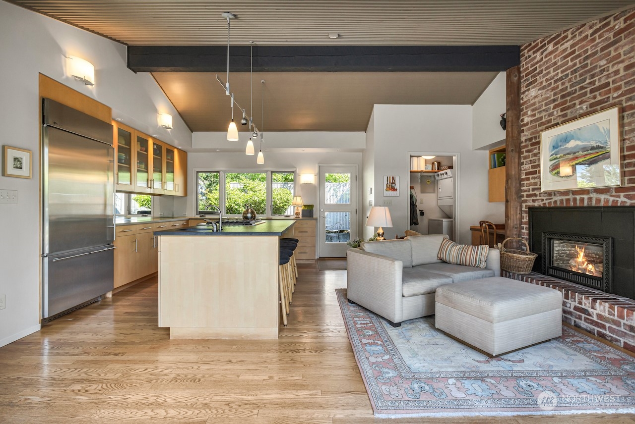 234 Middlefield Road Bellingham, WA 98225 - Photo 16 of 36 a living room with furniture a fireplace and a chandelier
