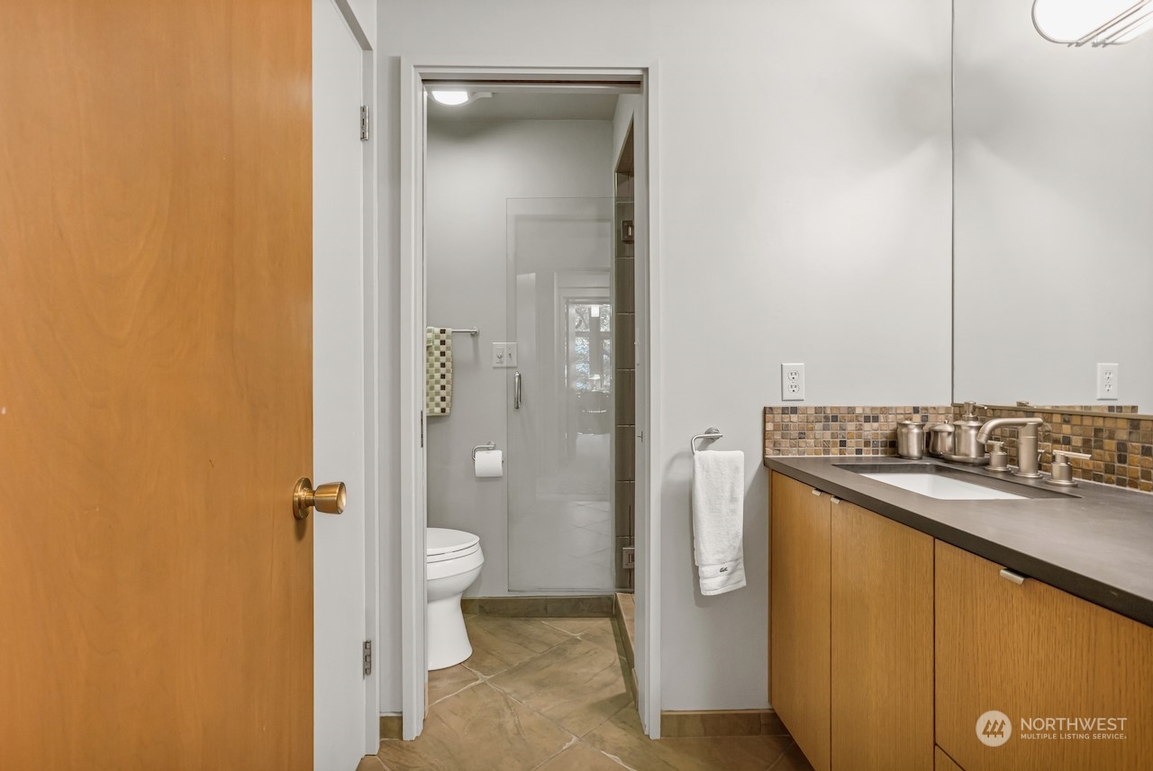234 Middlefield Road Bellingham, WA 98225 - Photo 24 of 36 a bathroom with a sink and mirror with toilet